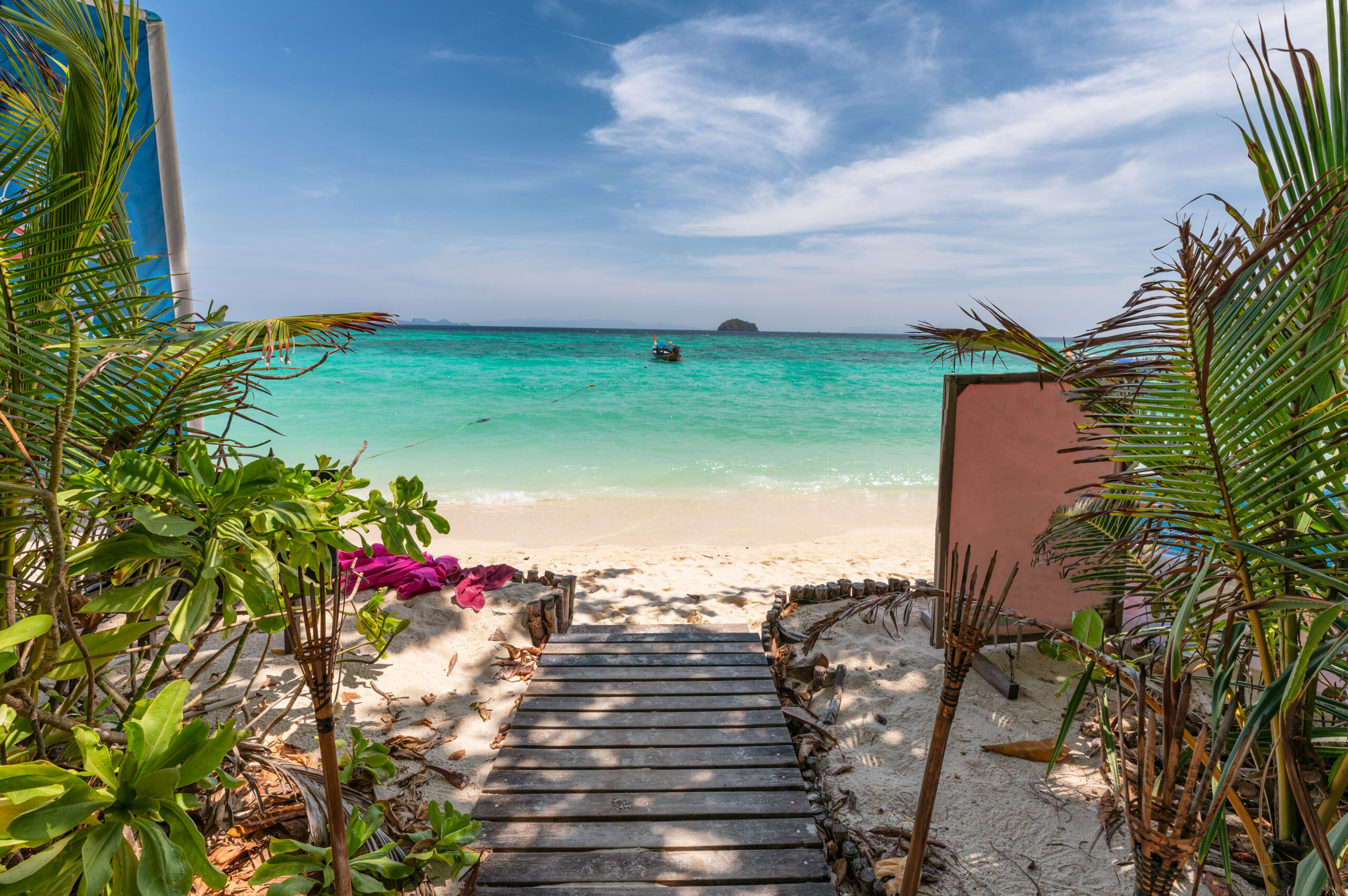 5-Day Bush to Beach: Northern Safari & Zanzibar Escapes wooden bridge with green plant on tropical sea and blue sky